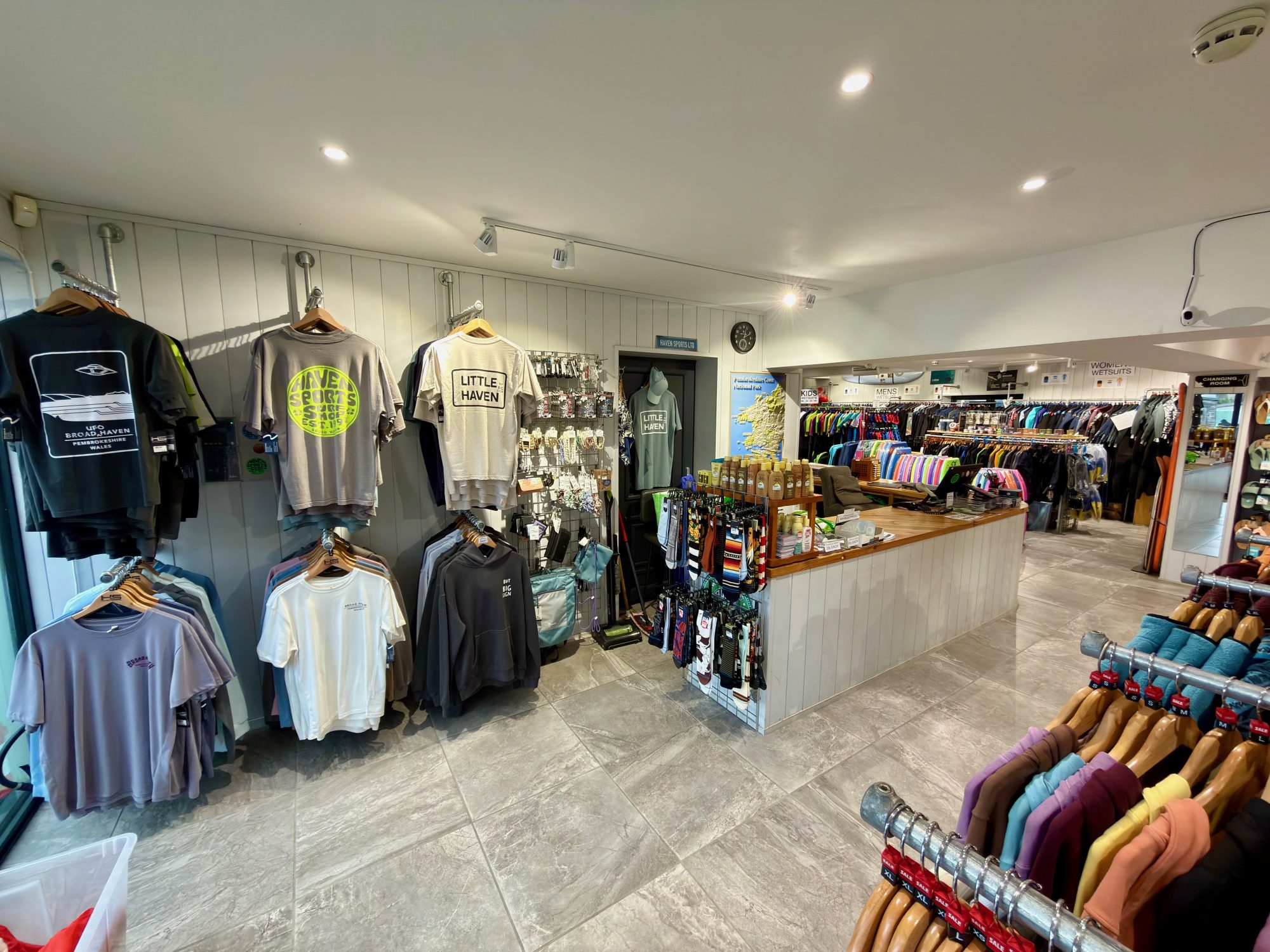 The inside of the Surf shop in Broad Haven showing display of local T shirts