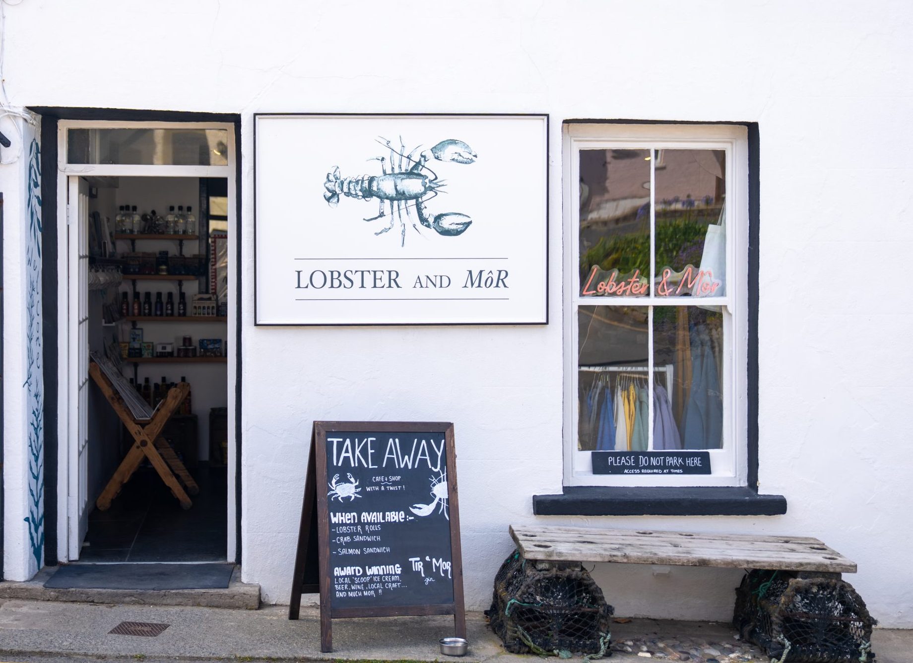 Shop front of Lobster and Mor in Little Haven showing the shop sign